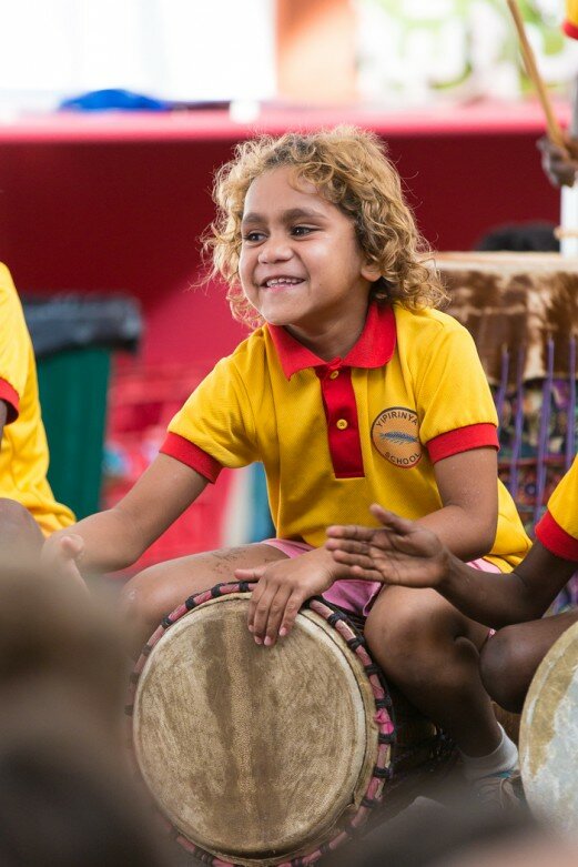 A Yipirinya student enjoying the drums.